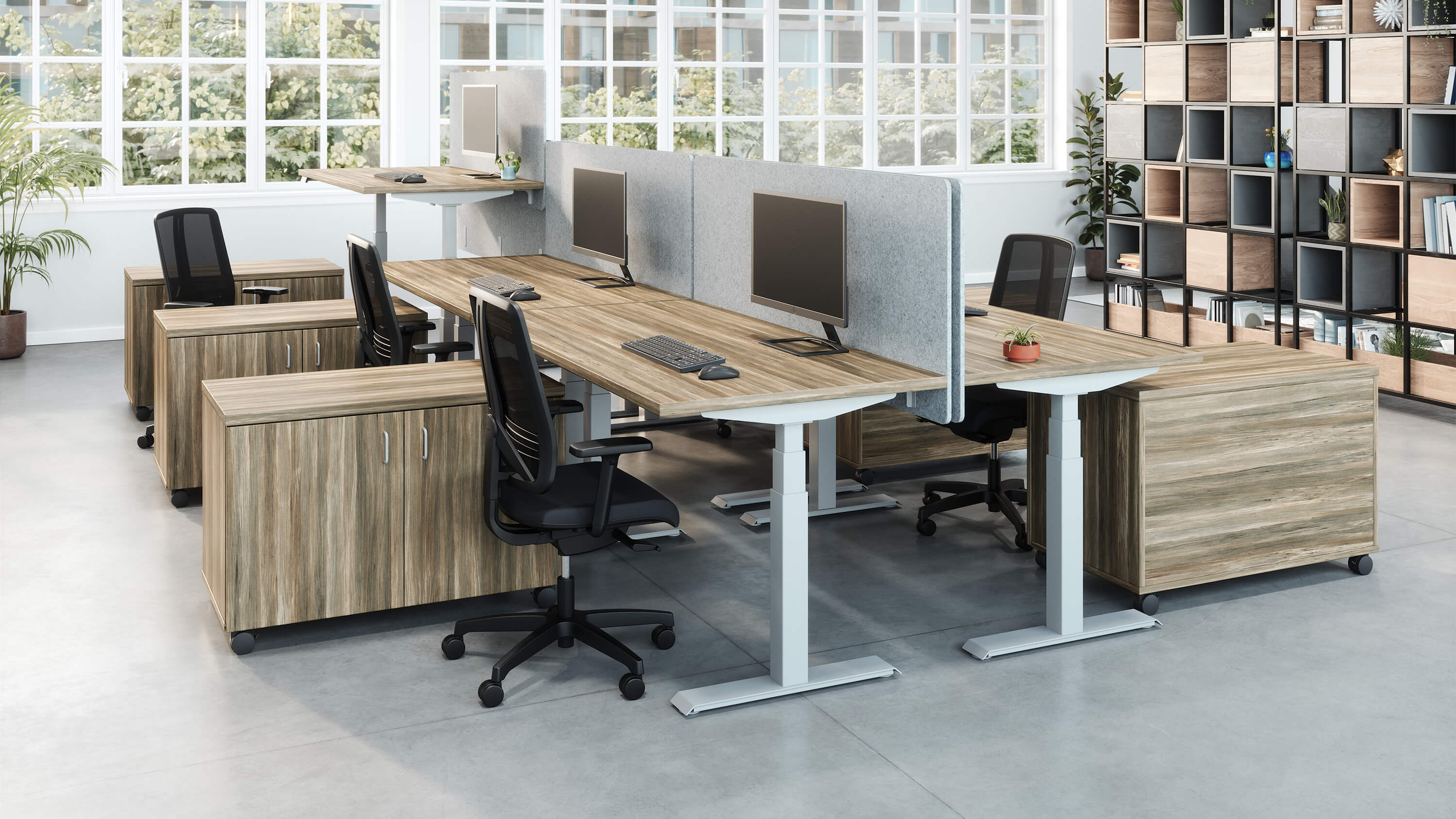 Valco electric height adjustable desk with Tevita storage in open office