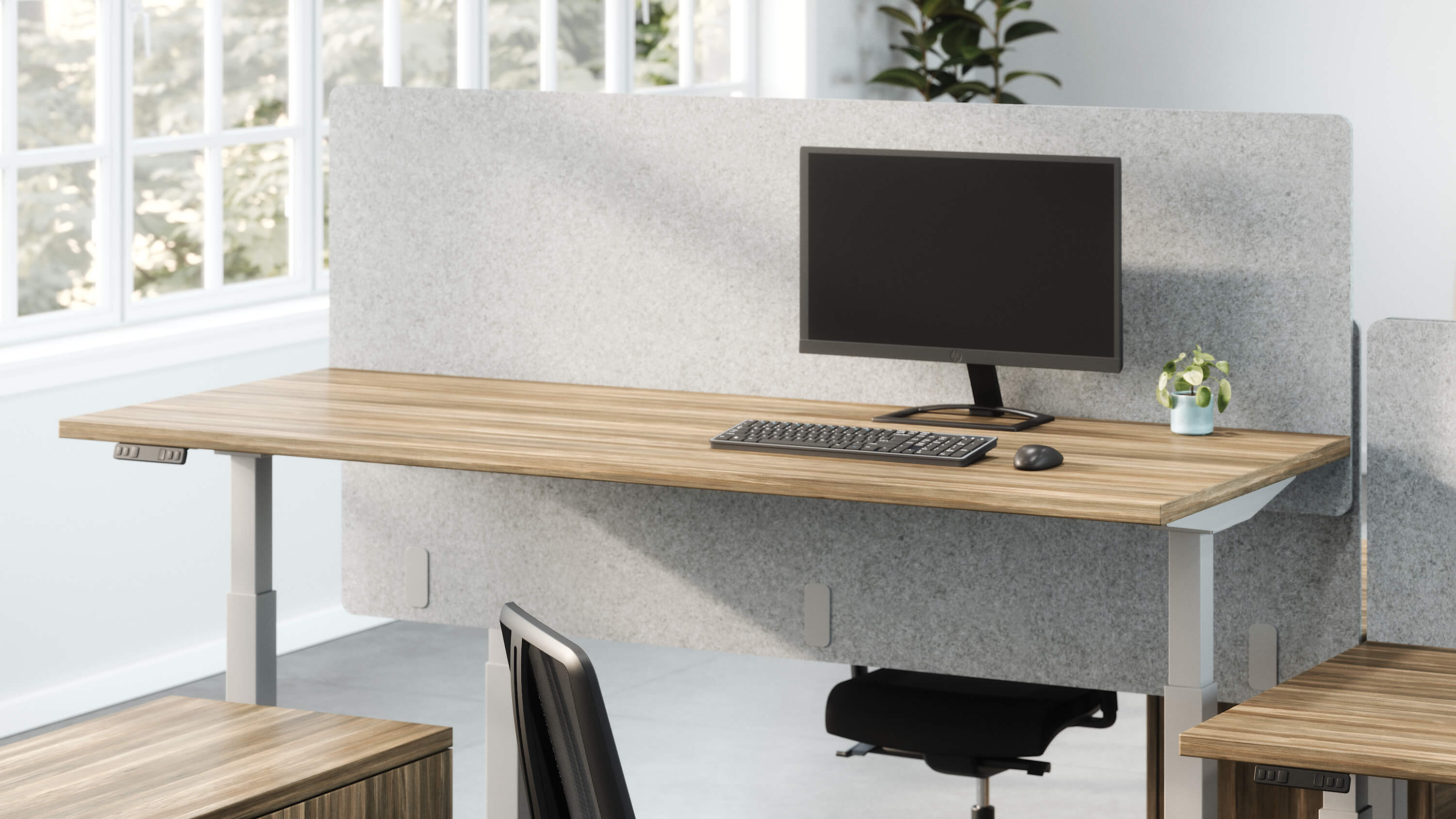 Valco electric height adjustable desk with Tevita storage in open office