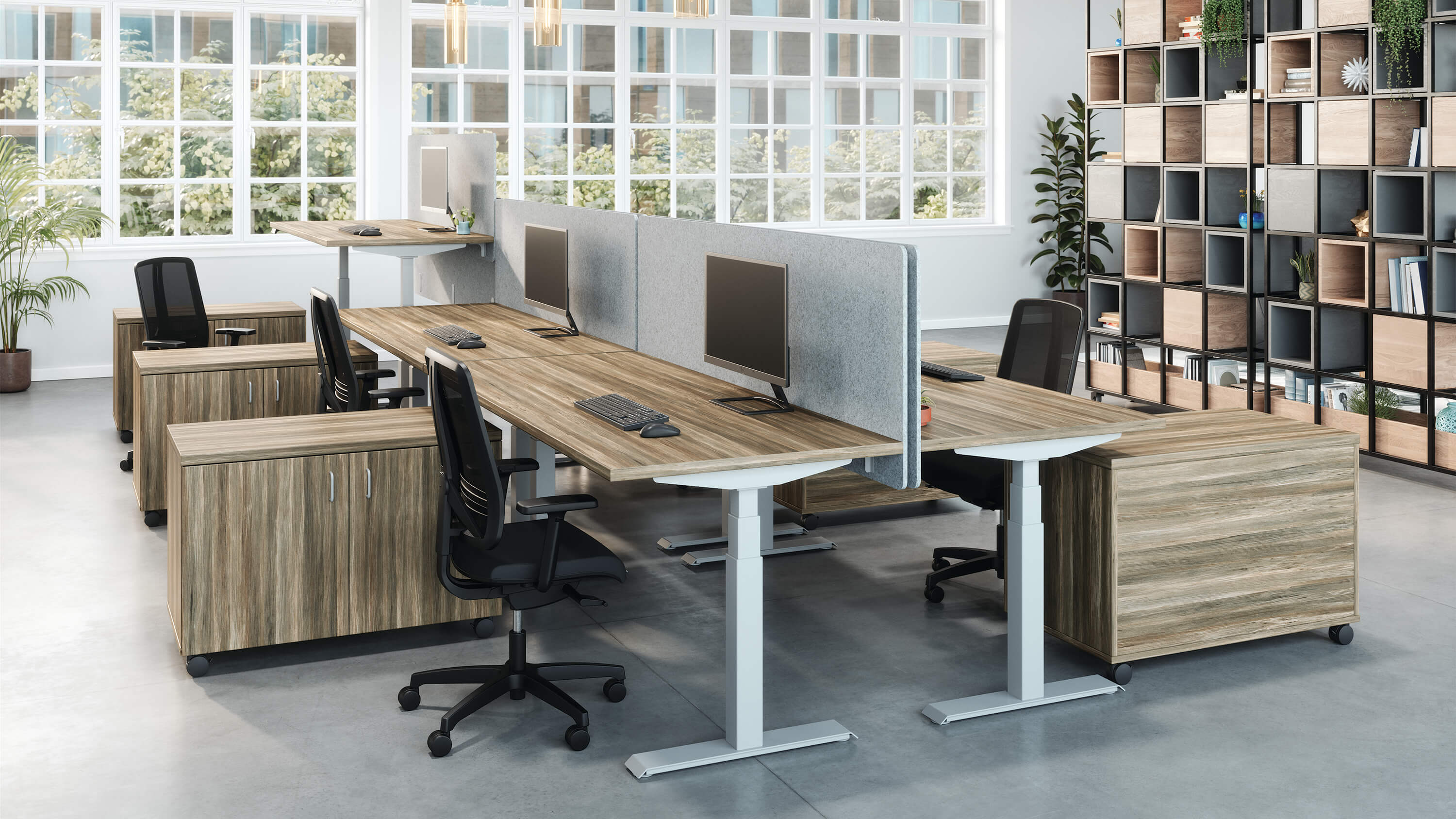 Valco electric height adjustable desk with Tevita storage in open office