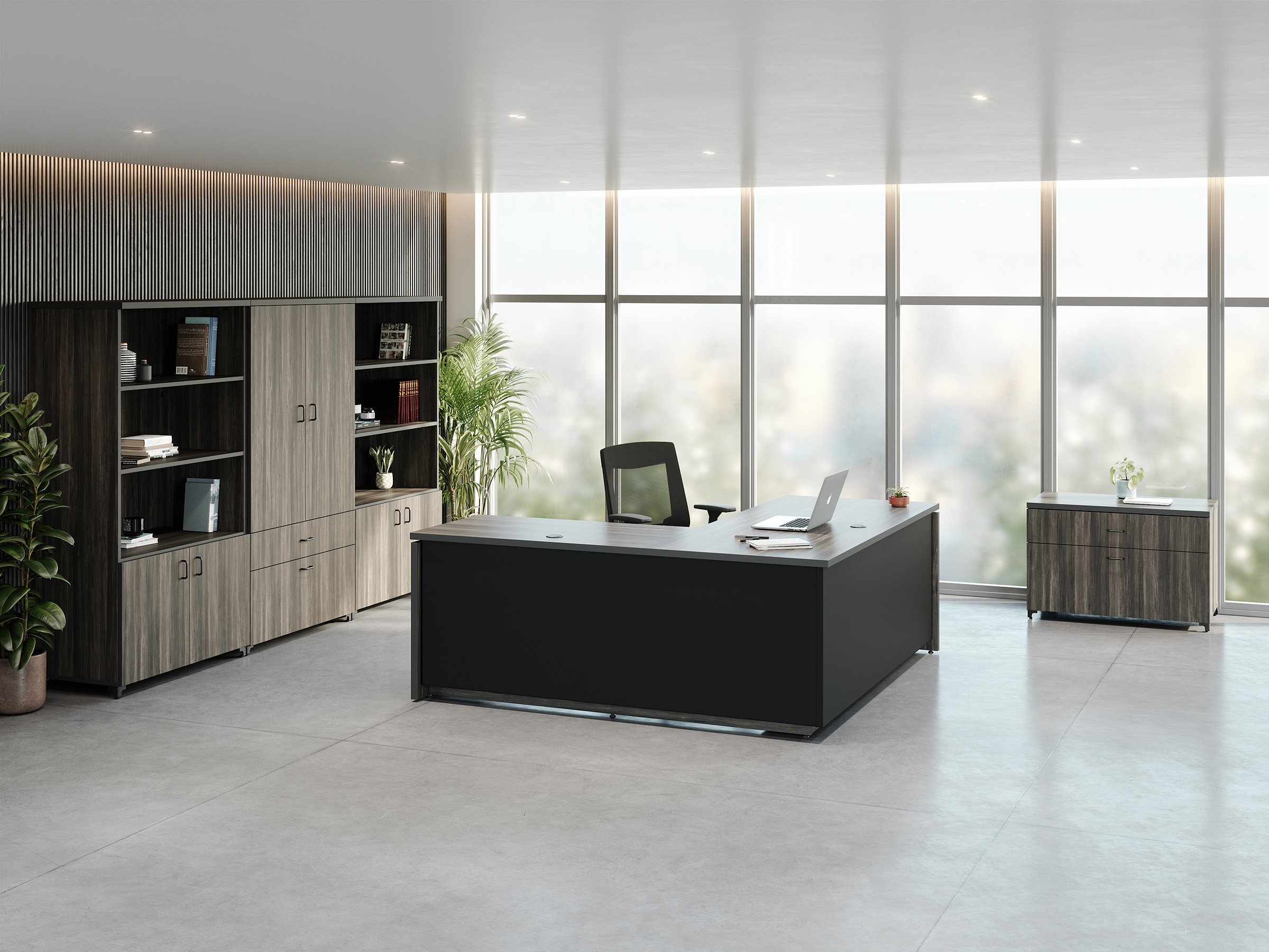 Presidente Executive fully enclosed L shape electric standing desk in seated position in modern private office with Tevita laminate vertical and credenza storage system